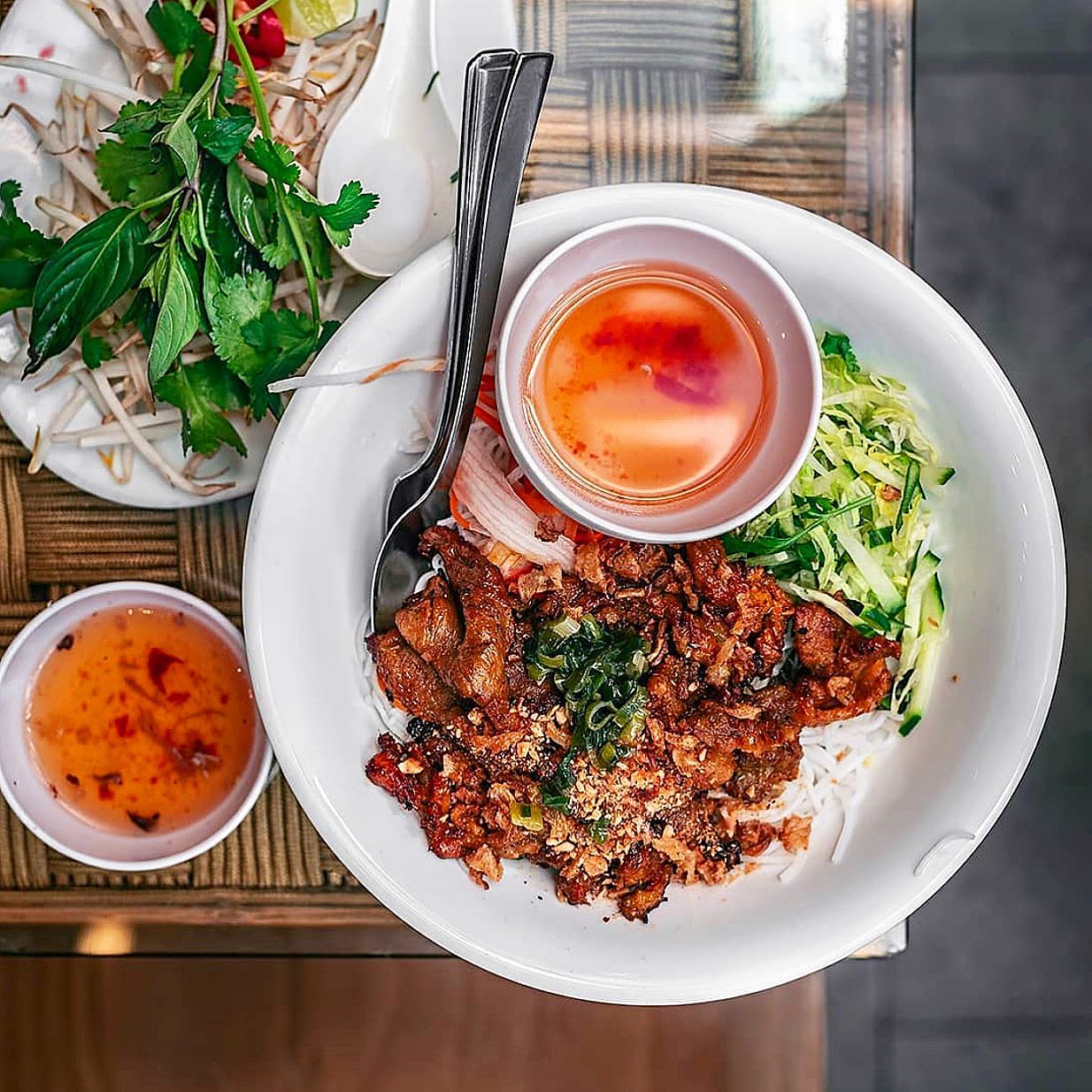 Bún thịt nướng with grilled pork, vermicelli and herbs